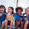 Group Of Cheerful Multi Ethnic Children Eating Ice Cream In Summer