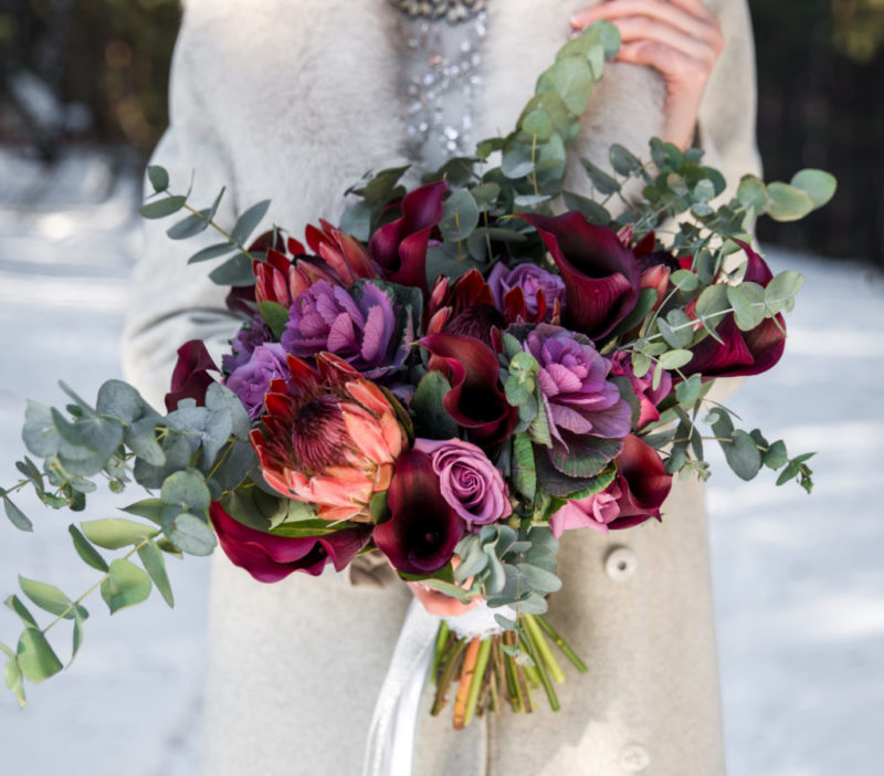 Wedding bouquet in hands of the bride