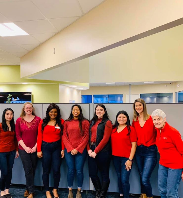 staff in red tops and sweaters