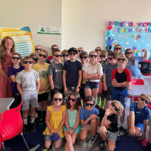 Fourth and fifth graders at the Boys & Girls Club of Kennebec Valley (BGCKV) posing for a photo with sunglasses on after Junior Achievement of Maine and cPort Credit Union’s financial education course