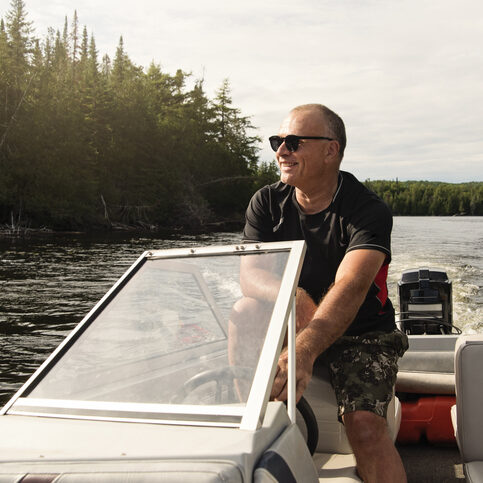 man driving a boat