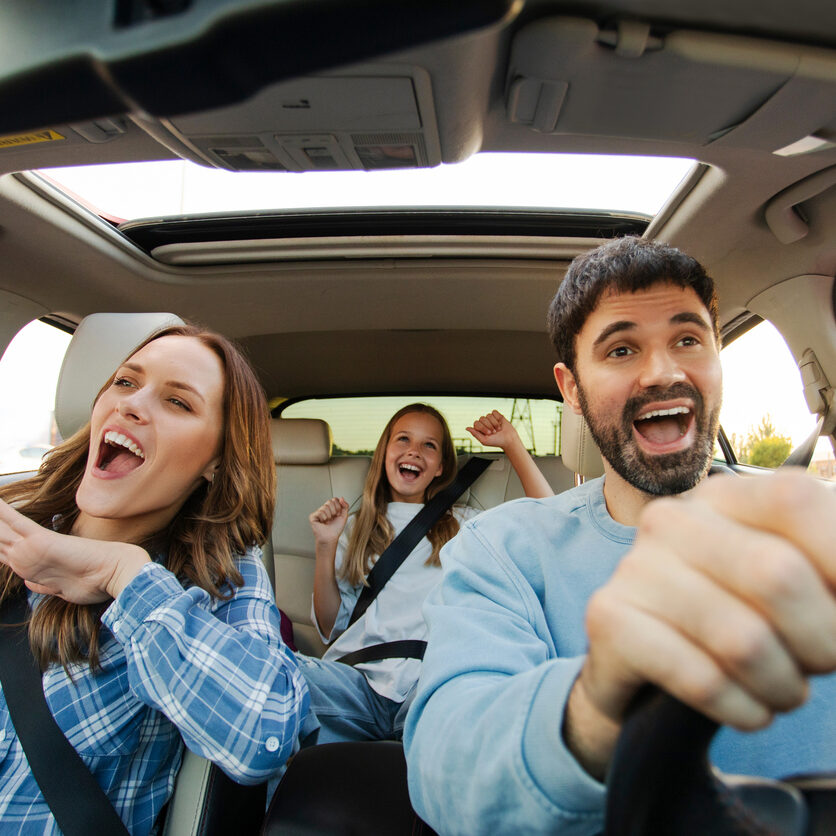 Family laughing in car